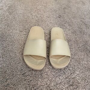 CROCS Classic Slide Sandals in Beige